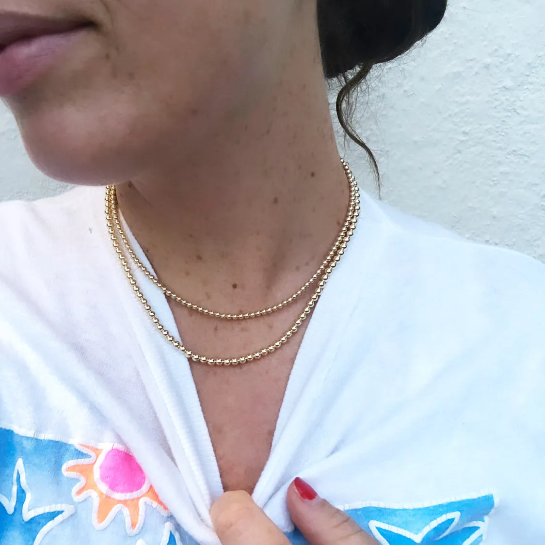 Gold beaded necklaces